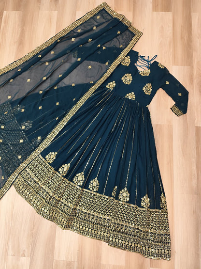 Elegant Rama green gown with zari and sequin embroidery and matching dupatta.