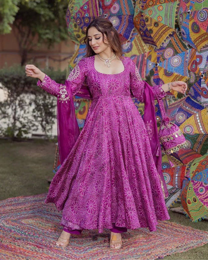 Model in flowing purple digital print gown with matching set