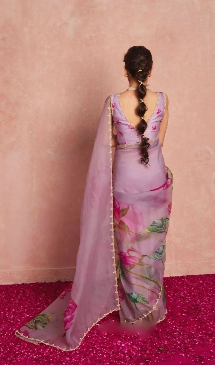 Back view of model in ready to wear floral printed organza saree with matching blouse.