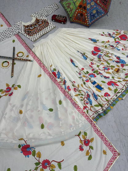 Top view of lehenga choli set with folk motifs, embroidered dupatta, and colorful Navratri umbrella.