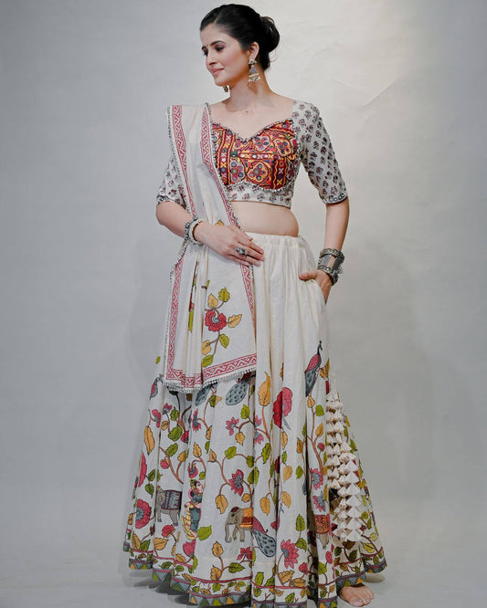 Woman wearing Gamthi Grace Lehenga Choli with mirror work, folk motifs, and floral prints, styled for Navratri.