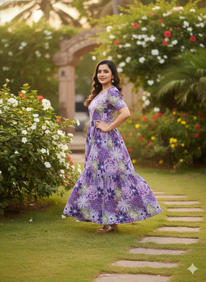 Side view of a woman in a flowing purple floral maxi dress, summer style.