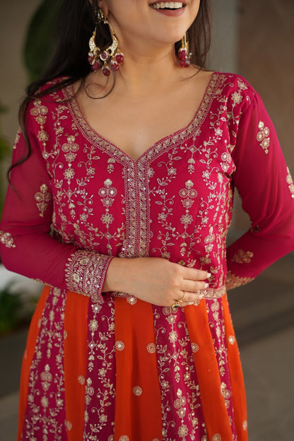 Top-down view of a pink and orange designer gown with embroidered details.