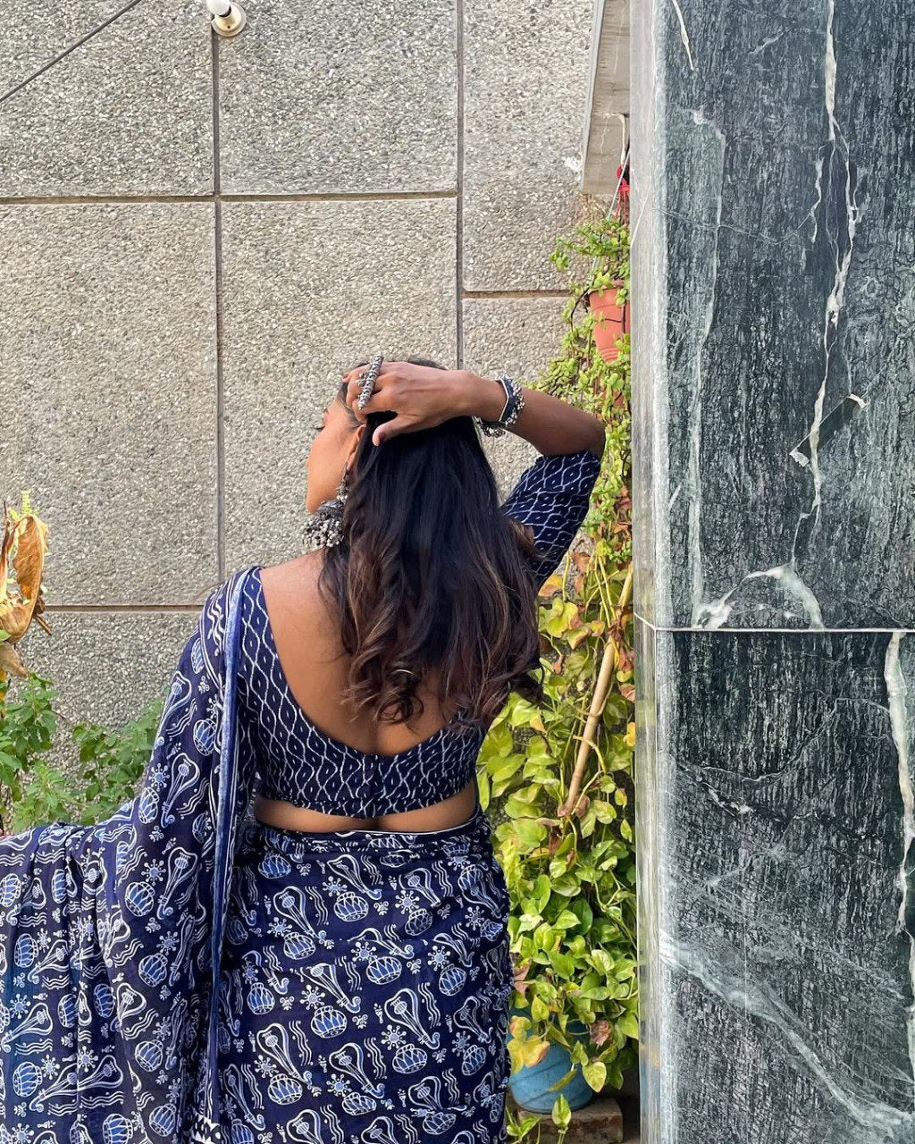 Close up of fabric design on blue and white cotton saree.