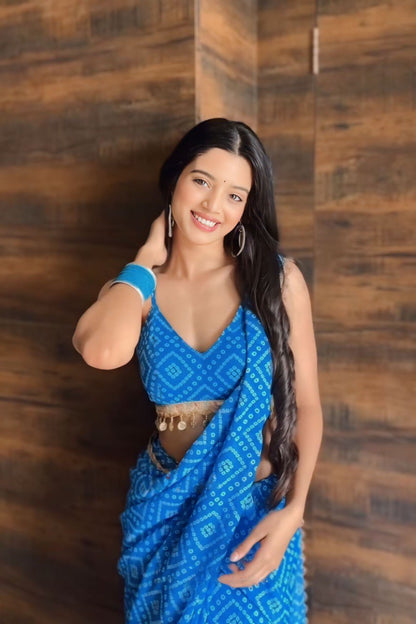 Woman in blue printed georgette ready to wear saree; lightweight and stylish.