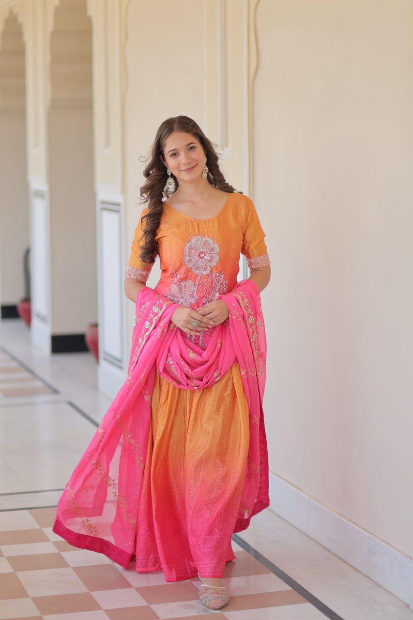 Full view of model in Sharara Suit with flowy pink dupatta