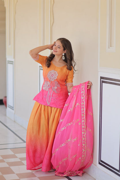 Model posing in designer Sharara Suit with embroidered details