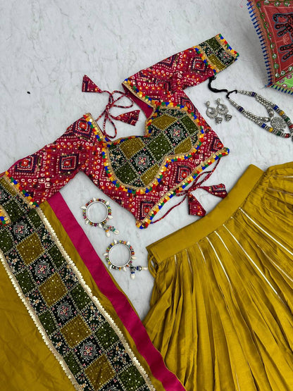 Complete Golden Gamthi lehenga set displayed with colorful umbrella and accessories.