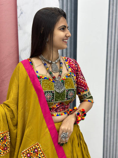 Smiling woman in traditional mustard cotton choli with Gamthi work and silver jewelry.