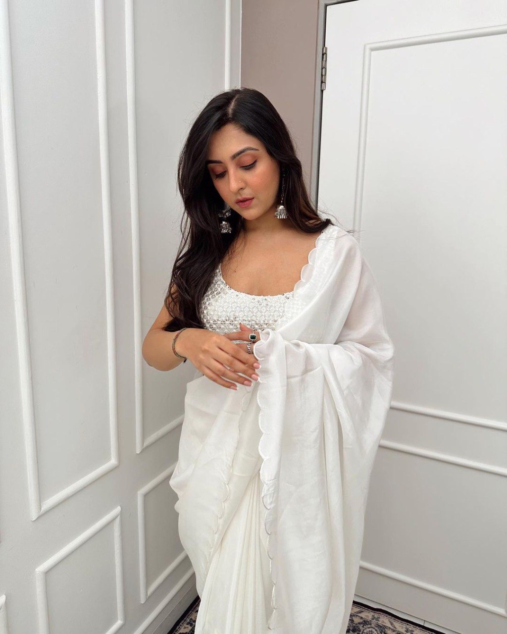 Close-up of beaded blouse with white ready to wear Rangoli silk saree.