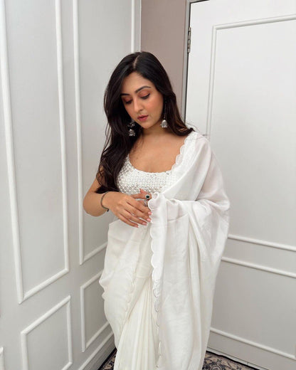 Close-up of beaded blouse with white ready to wear Rangoli silk saree.