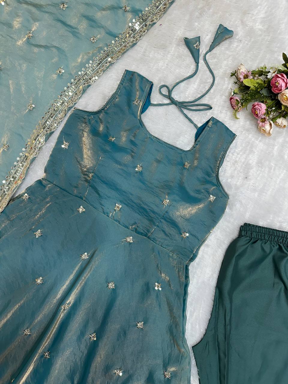 Teal embroidered gown, pants, and dupatta set.