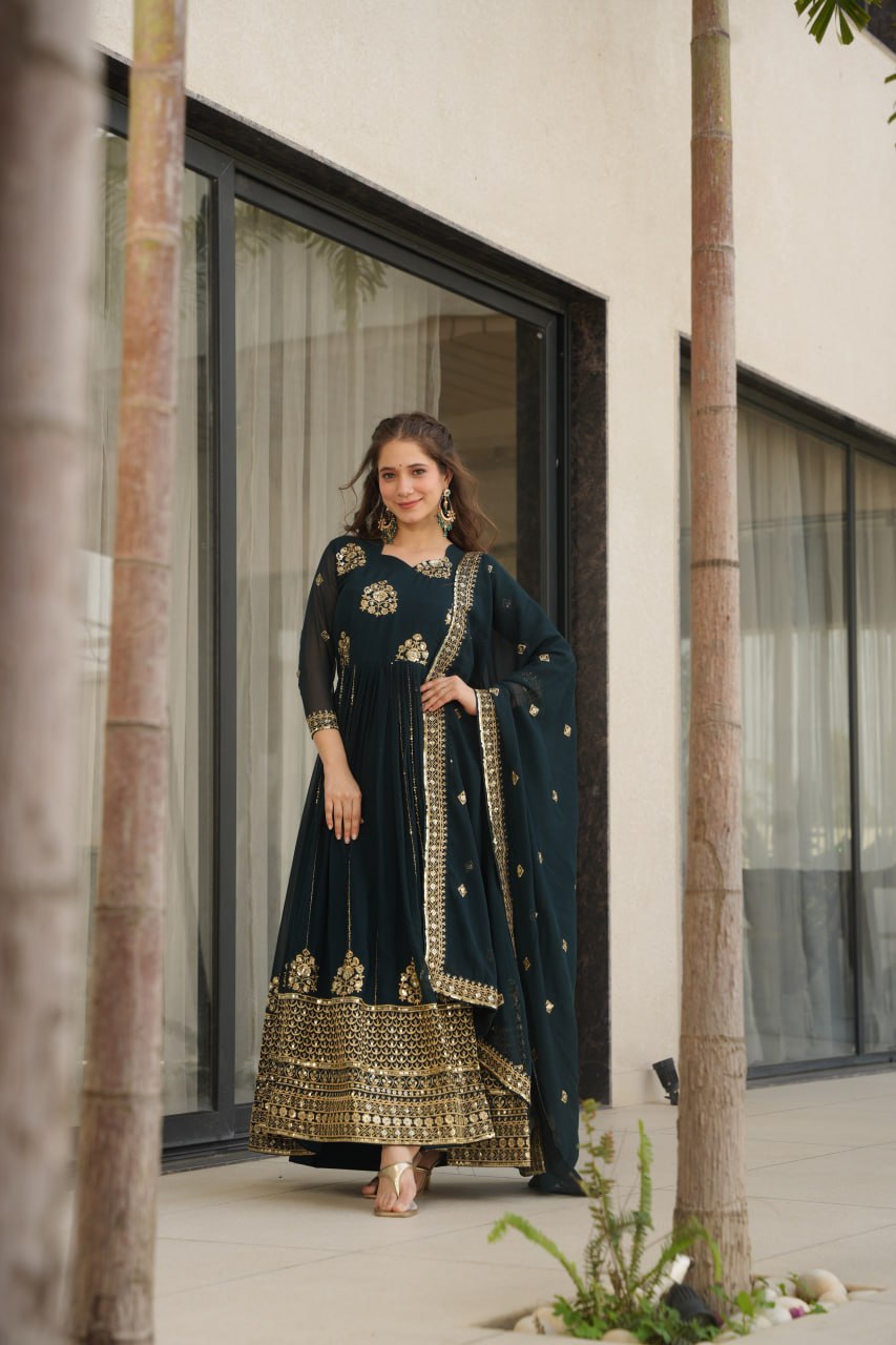 Rama green gown with dupatta, worn by a woman outdoors.