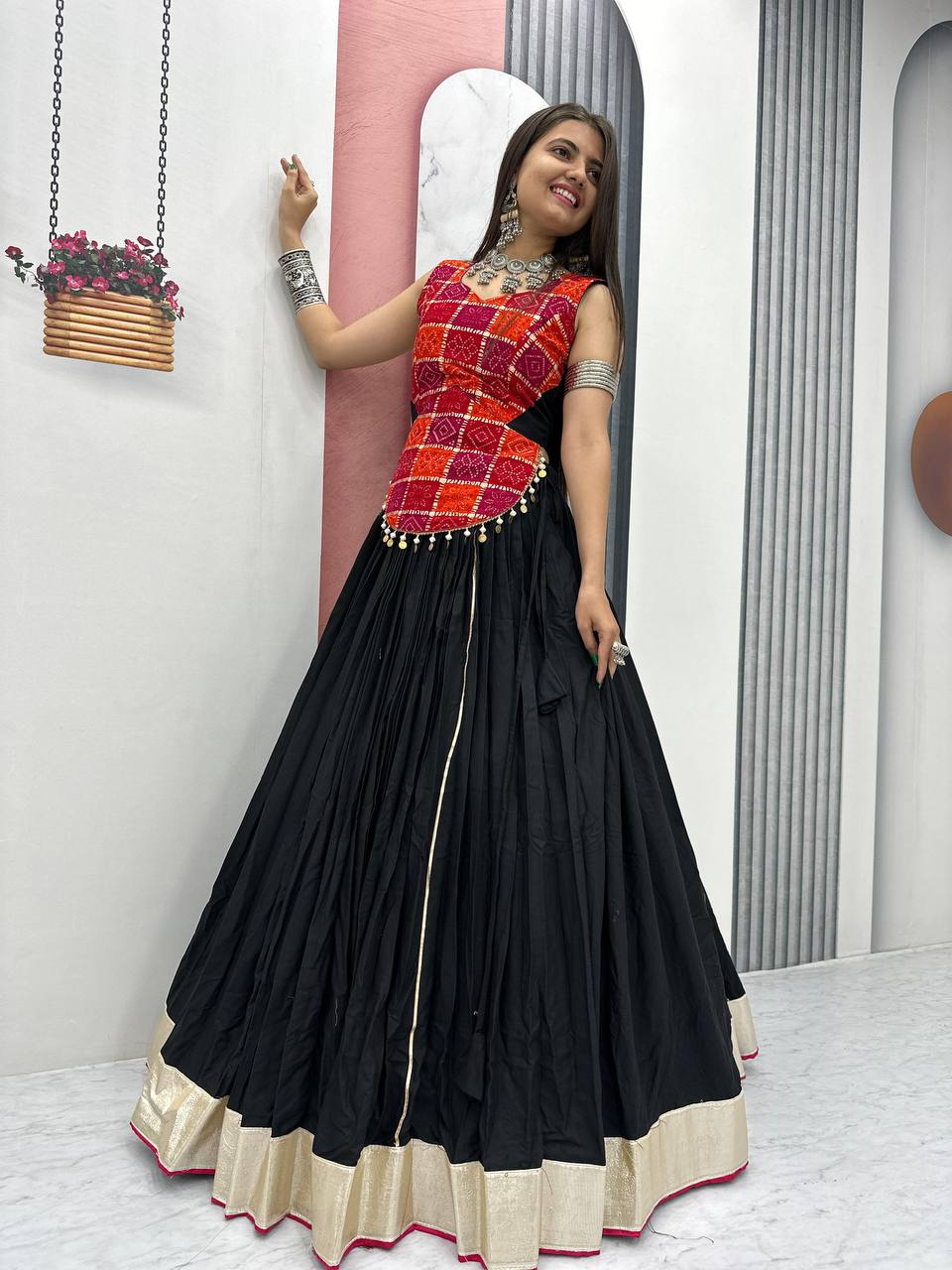 Side view of pure cotton lehenga choli set with luminous gold border and foil print details for festivals.