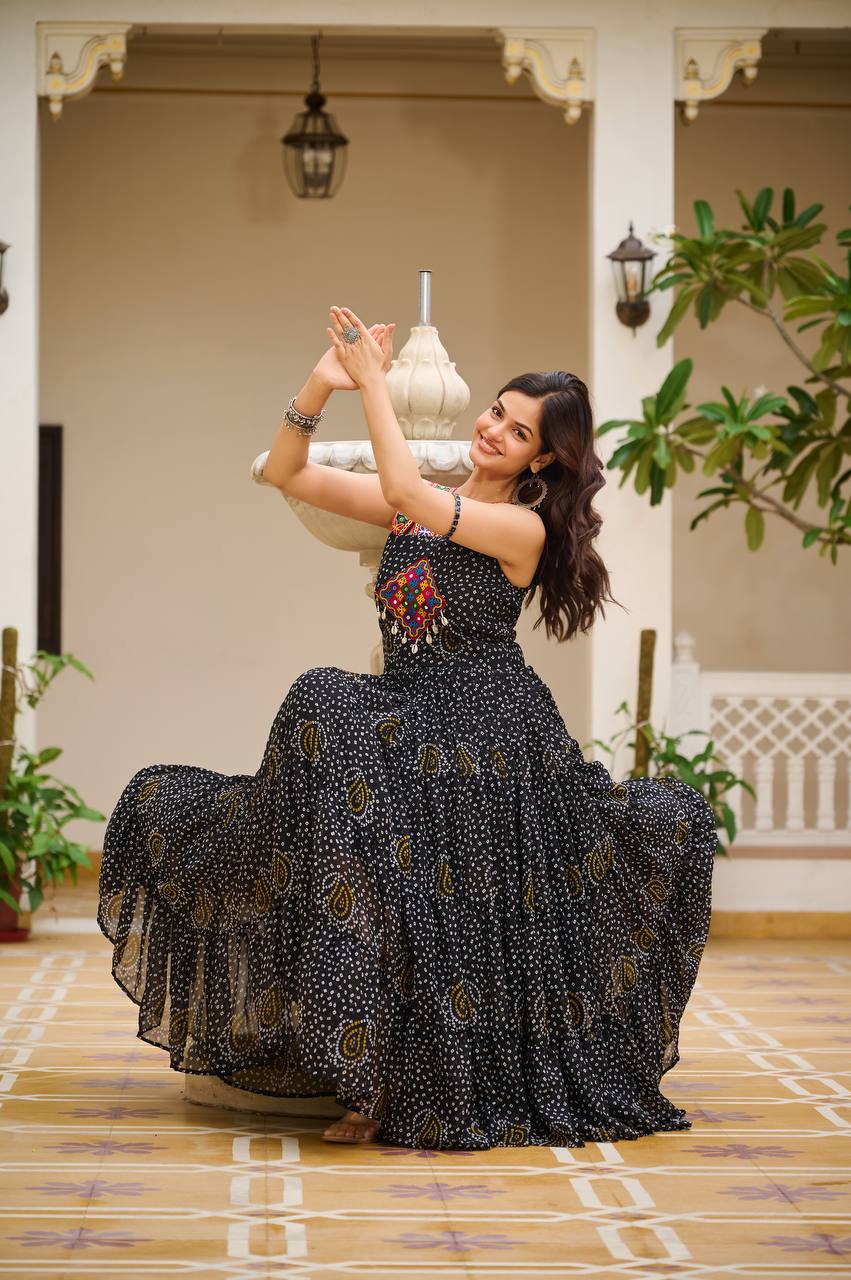 Classic black Bandhani gown with Gamathi embroidery, twirl-ready for Navratri night.