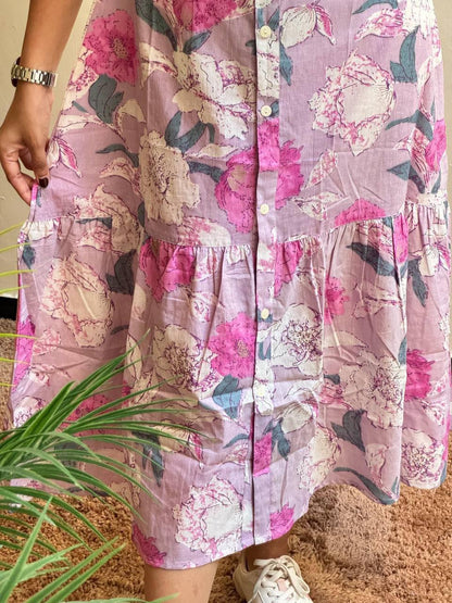 Close-up of the frill hem and floral print on the Lilac maxi dress.