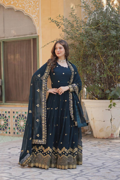 Elegant teal Anarkali gown with gold zari and sequin embroidery. Shop designer Anarkali suits online.