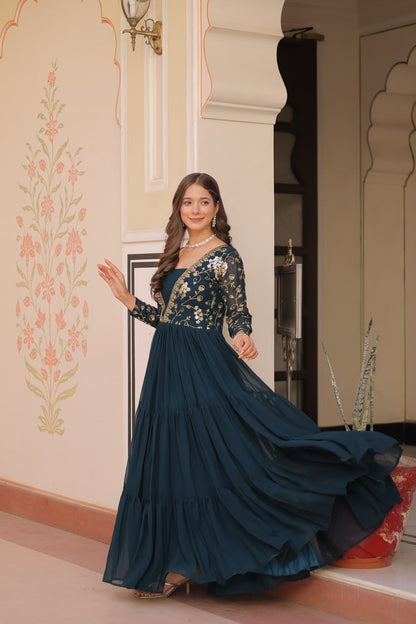 Flowing green gown with embroidery and full sleeves