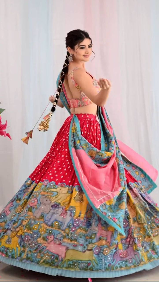 Woman in Kalamkari Lehenga Choli showcasing hand-painted design.