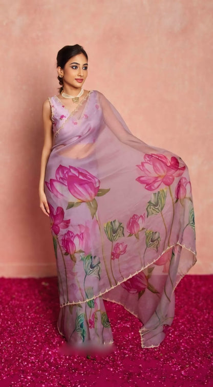 Close-up of the floral design on a ready-to-wear organza saree, scalloped edge detail.