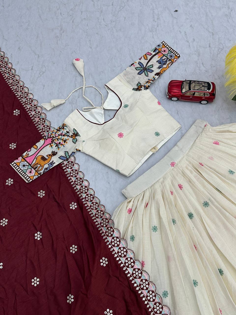 Overhead shot of the Rangbhoomi Lehenga choli and dupatta, highlighting the embroidery work.