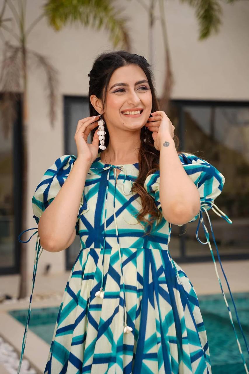 Close-up of model wearing blue-dark blue-white Sajda Maxi Dress.