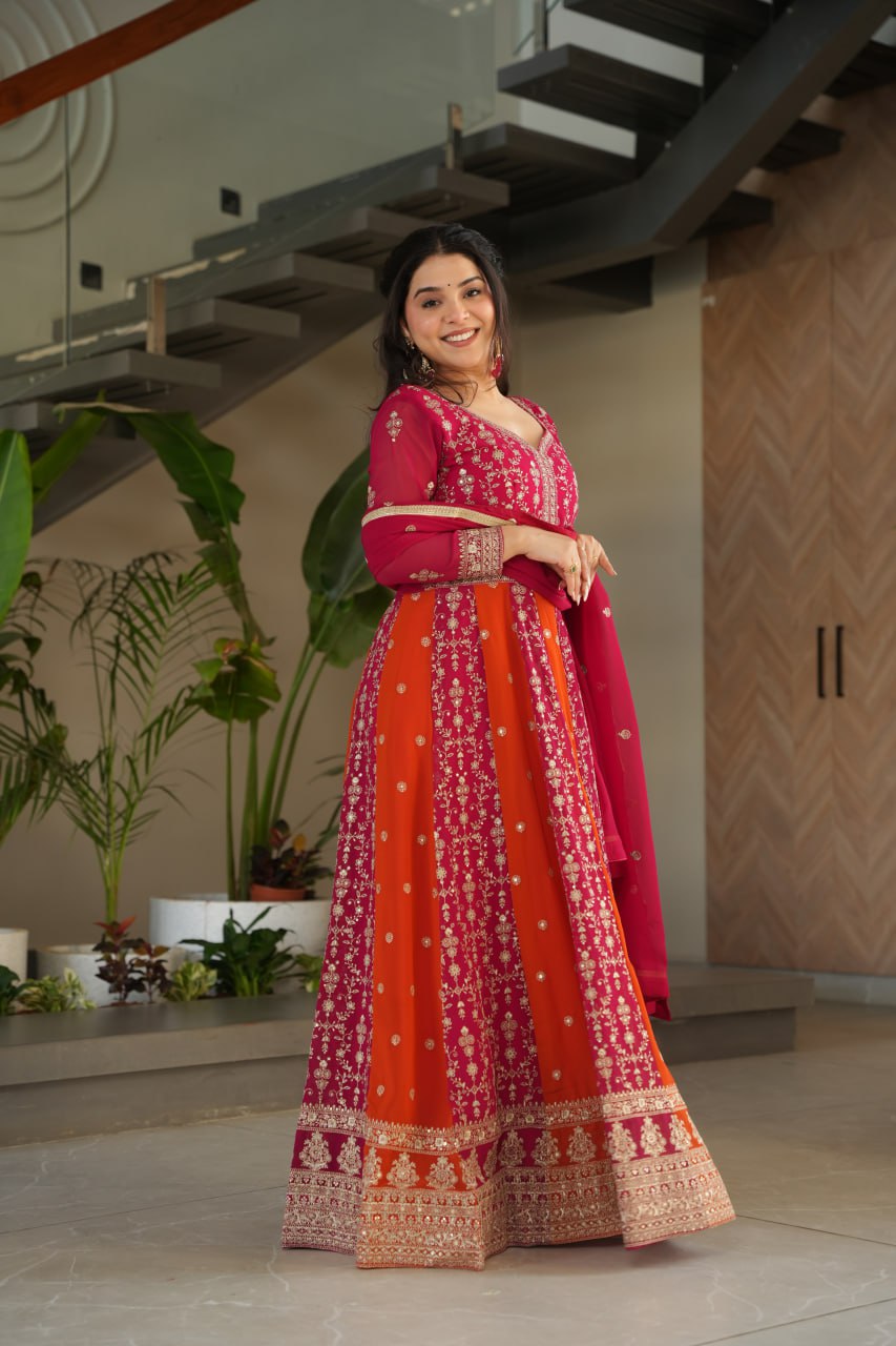 Full shot of a woman wearing a pink and orange designer gown.