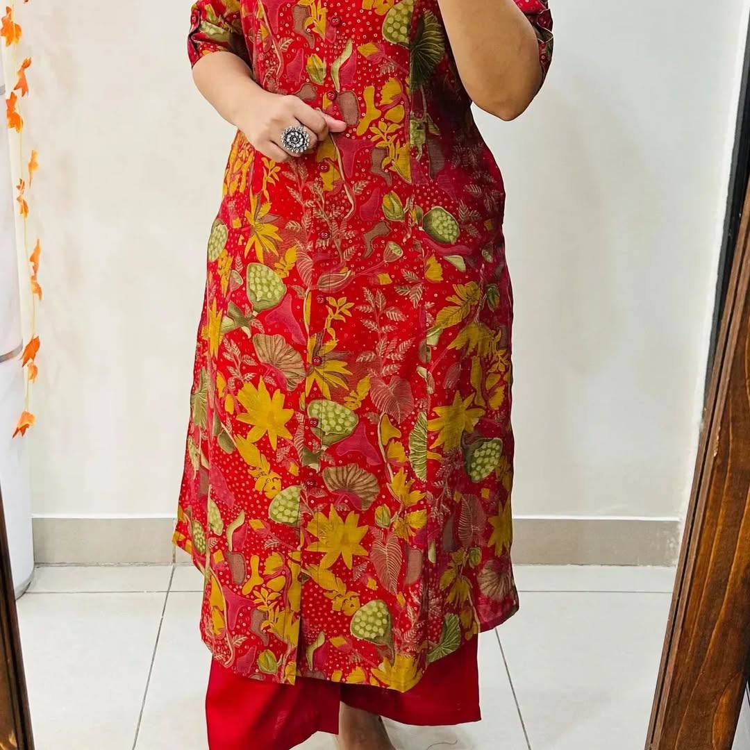 Red Forest floral print cotton A-line kurti with multicolor leaves and yellow flowers, mid-calf length.