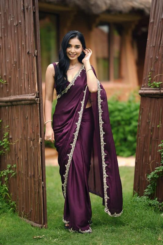Elegant woman in a purple Rangoli Silk Ready To Wear Saree with delicate border embellishments.
