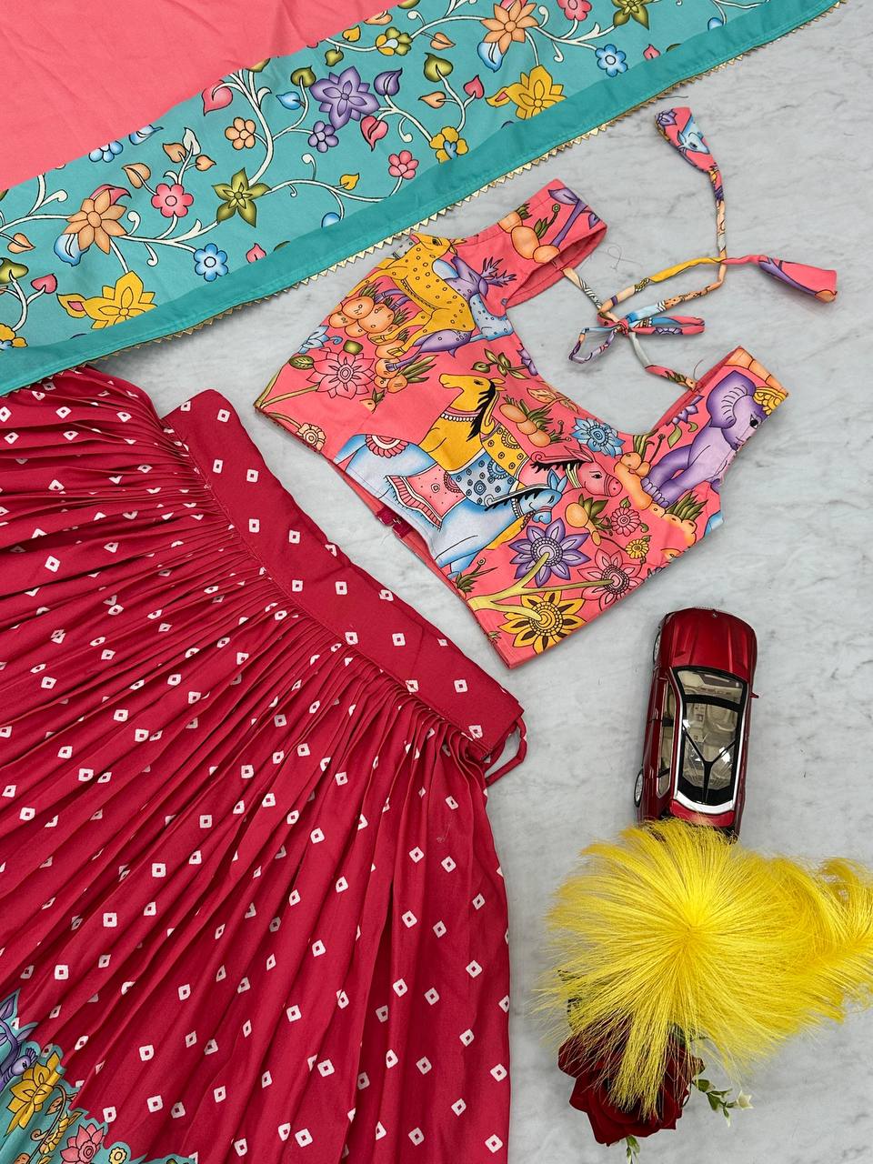 Top-down view of Kalamkari Lehenga Choli set with choli detail.