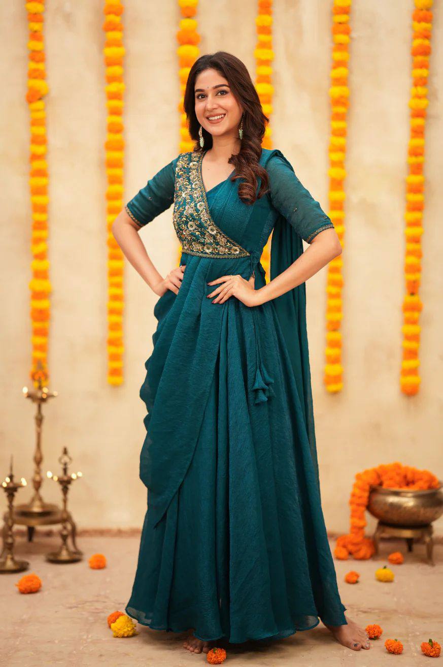Aqua pre-draped saree-anarkali featuring intricate embroidery and a stylish silhouette.