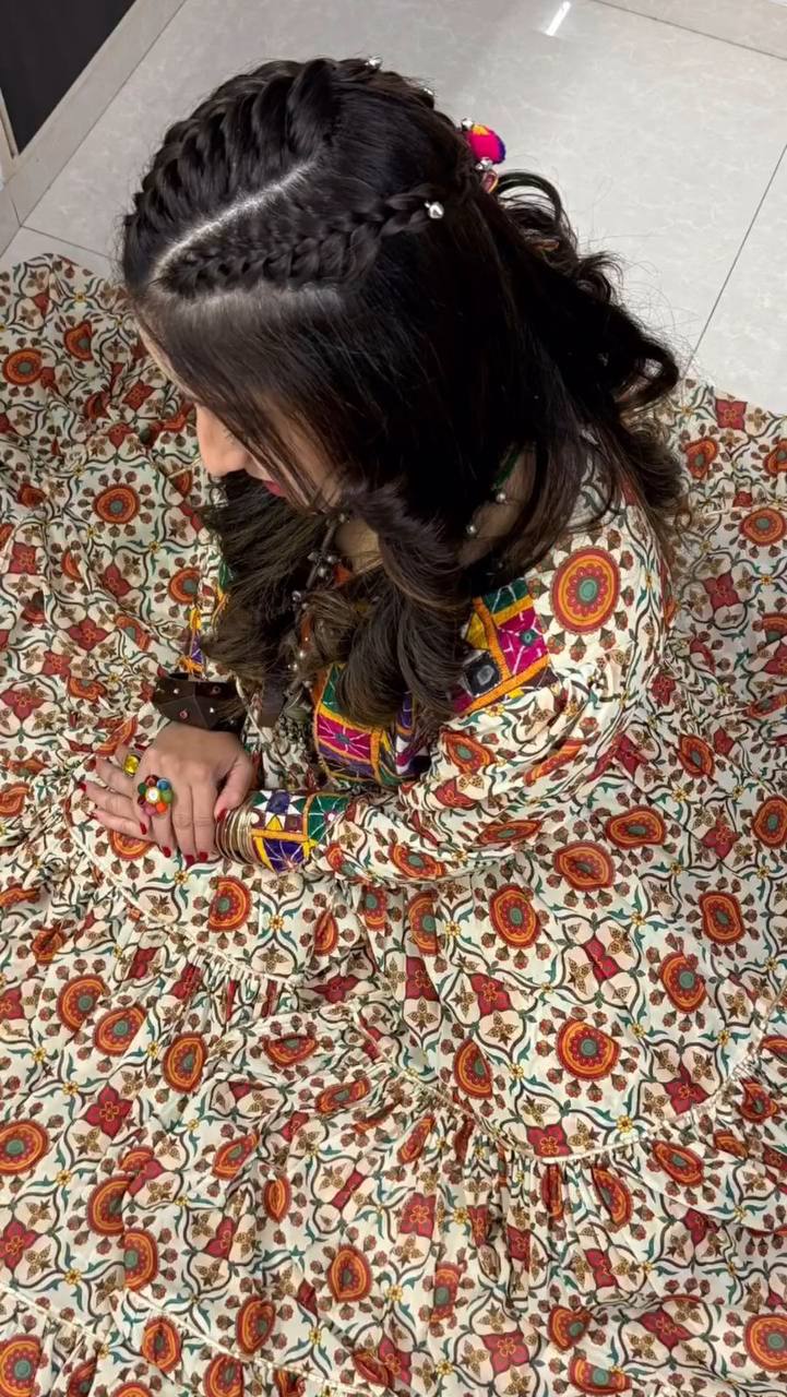 Top view of woman in Kachchi Charm lehenga choli, highlighting mirror work and detailed Kachchi embroidery.
