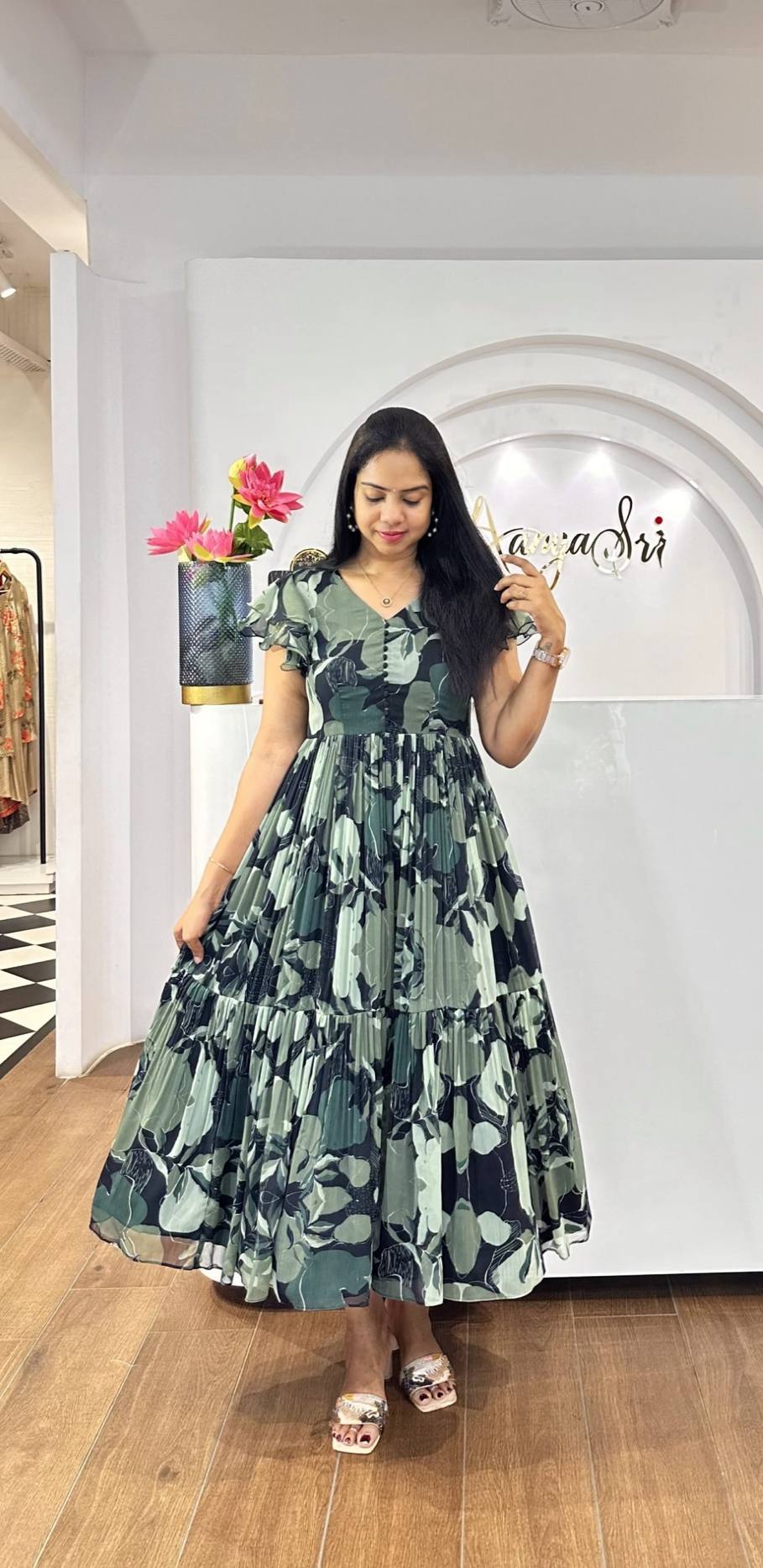 Close-up of short sleeve floral maxi dress worn in shop