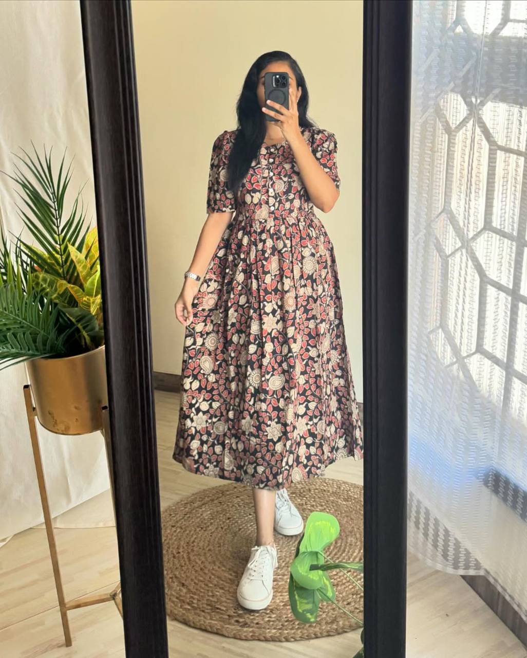 Full view of a model in the Kalamkari print maxi, styled casually.