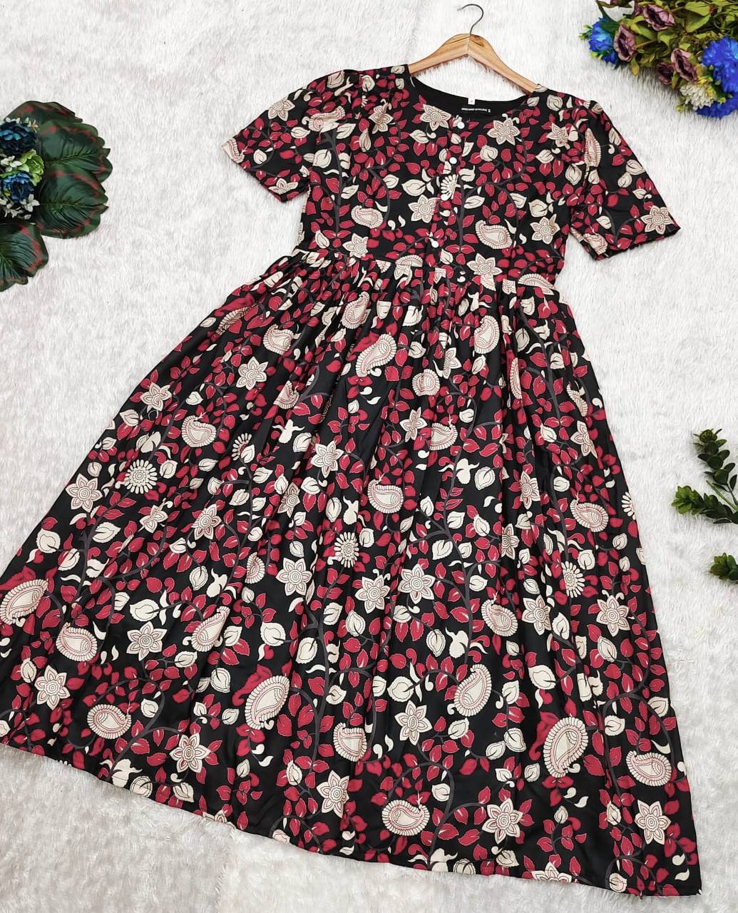 Kalamkari print maxi dress laid flat, showcasing the dress flare and print.
