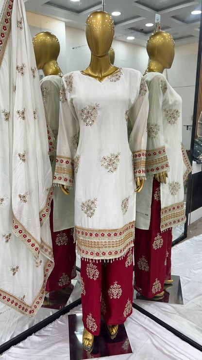 Close-up of white and red Rangbhoomi Silk Splendor Party Wear on mannequin.