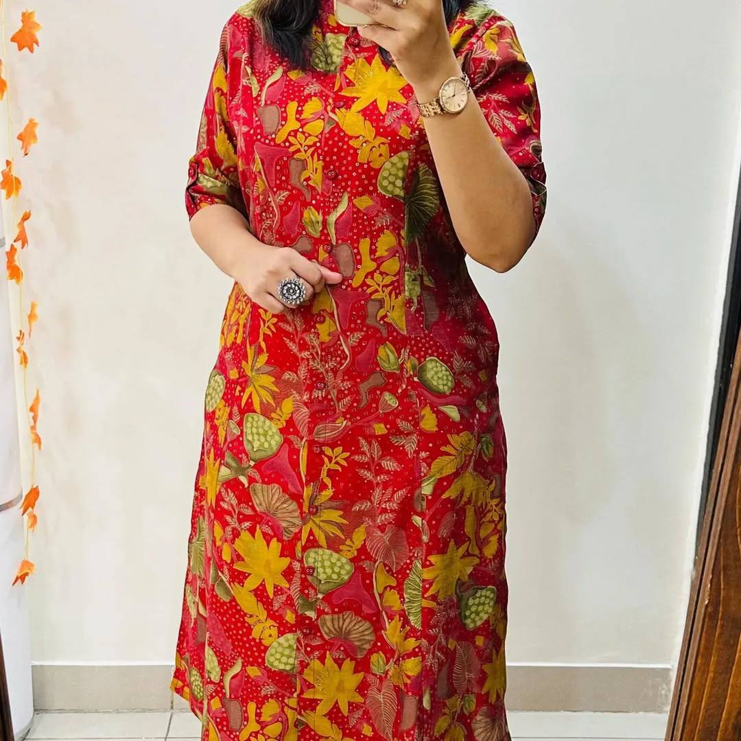 Front view of Red Forest floral cotton kurti in red with colorful leaves and yellow flowers, A-line fit.