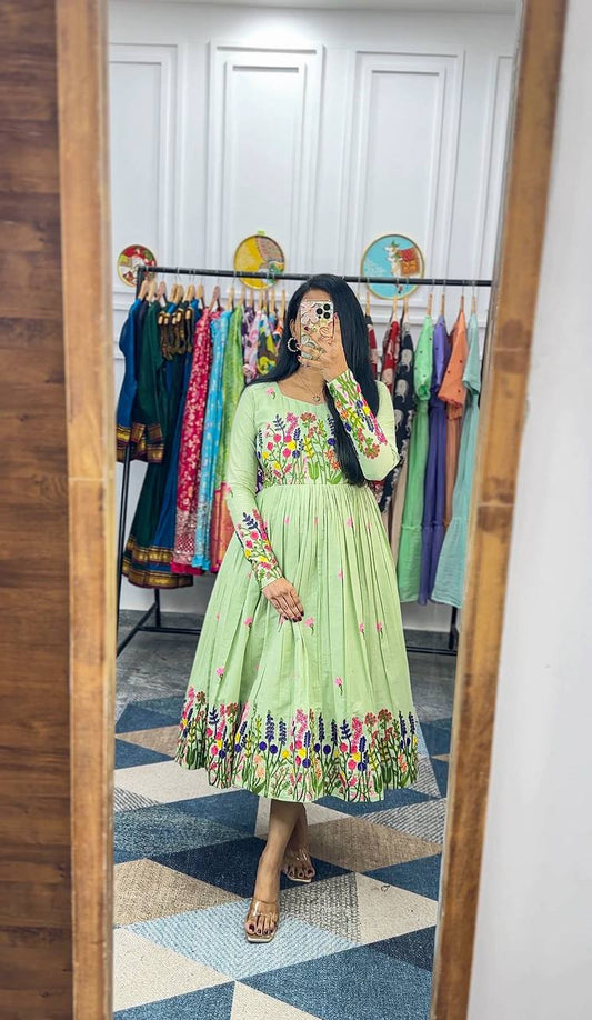 Light green Floral Elegance Maska Cotton Dress with embroidered sleeves and hem.