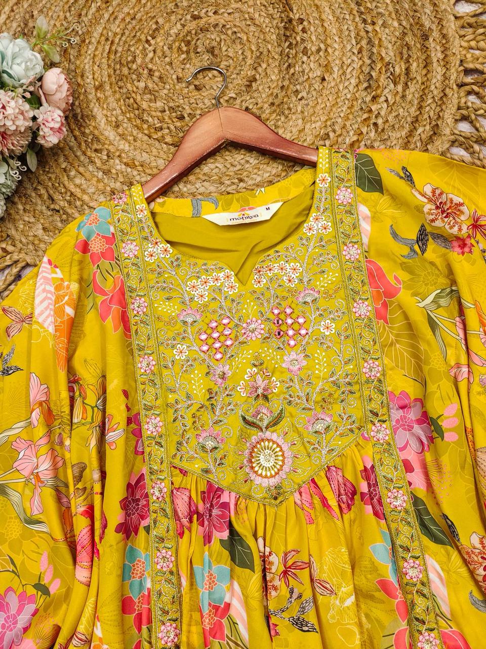 Yellow heavy crepe kaftan with floral digital print and intricate pink and gold embroidery.