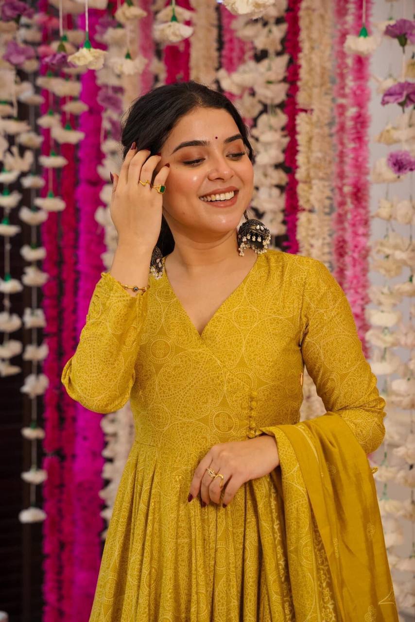 Close-up of Golden Bandhani Anarkali Suit Set with dupatta. Ethnic dress.