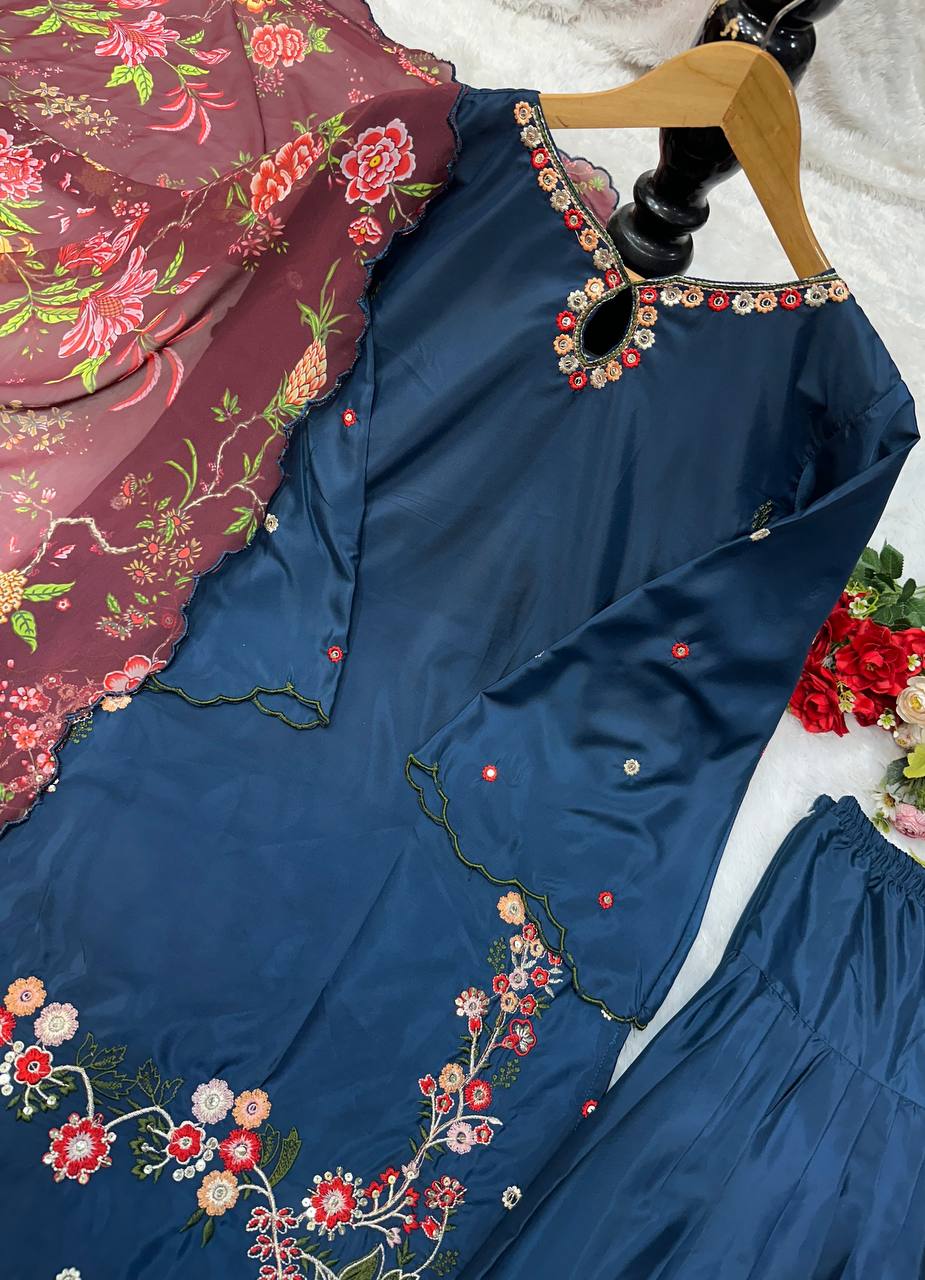 Flat lay of navy blue Farsi top with floral embroidery and maroon georgette dupatta detail.