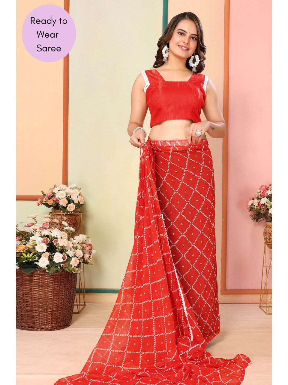 Woman wearing adjustable orange geometric print saree, perfect for parties and festive events.