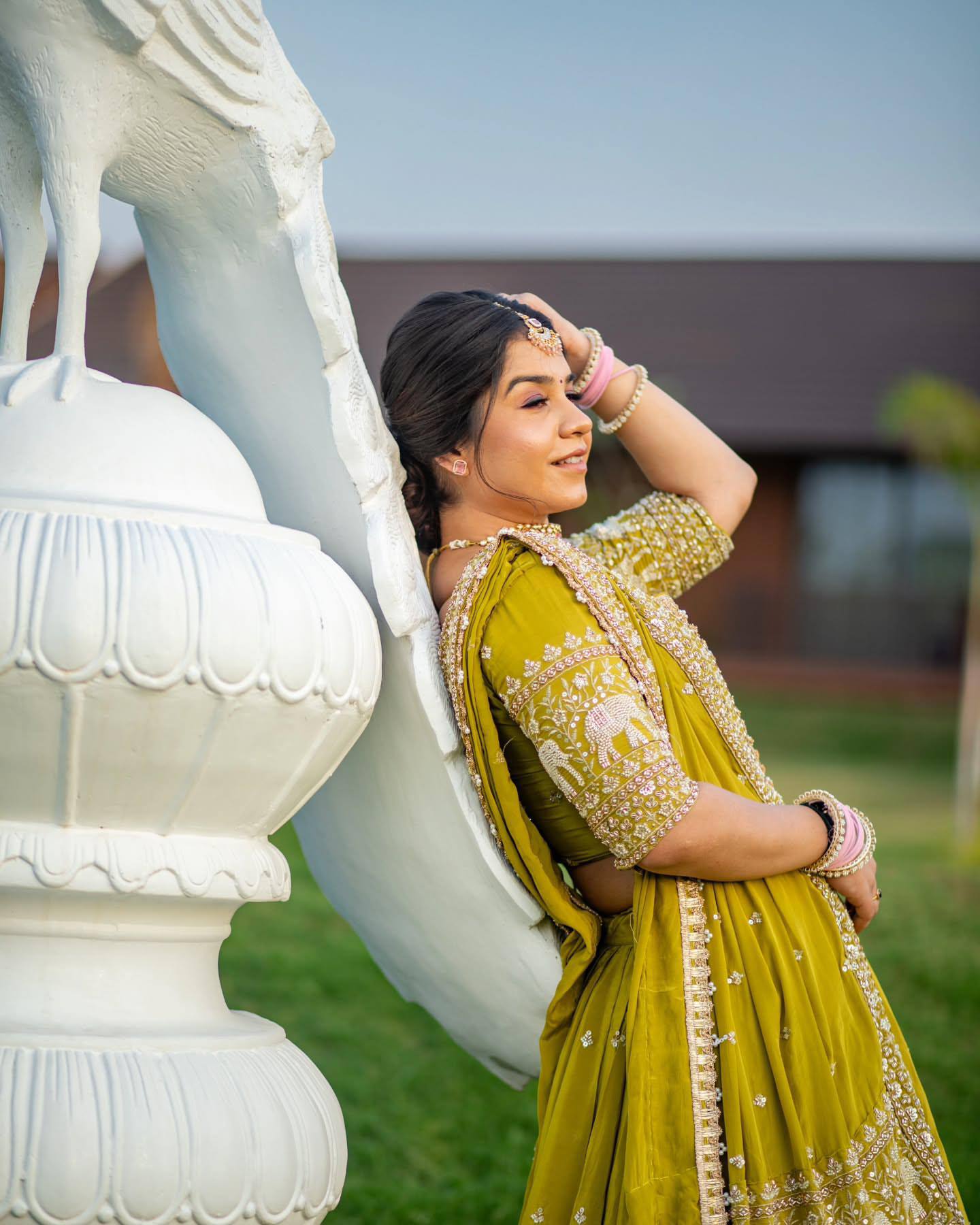 Model wearing lime green embroidered lehenga choli.
