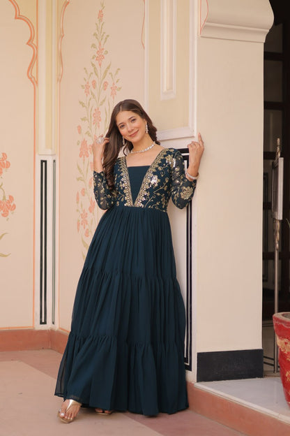 Woman posing in green embroidered premium gown