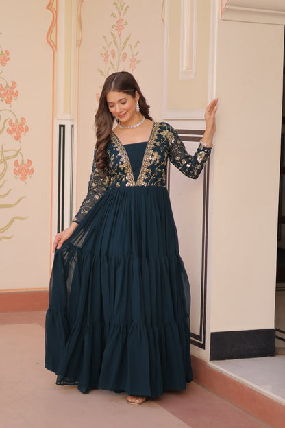 Full length view of green embroidered gown