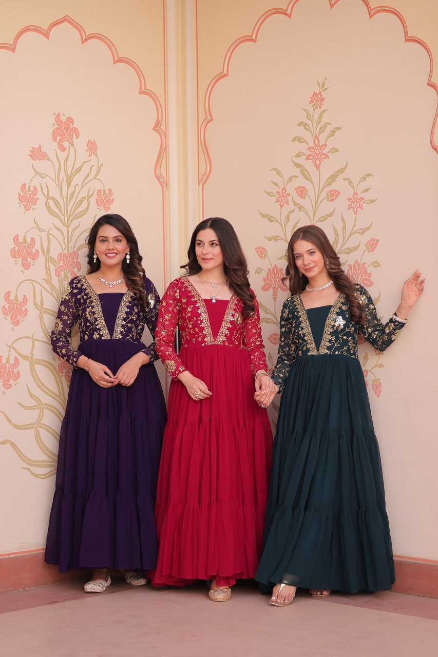 Three models wearing premium gowns in purple, red, and green