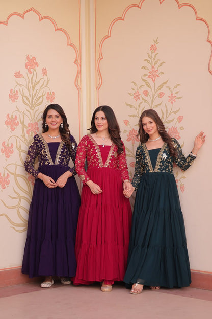 Three models wearing premium gowns in purple, red, and green
