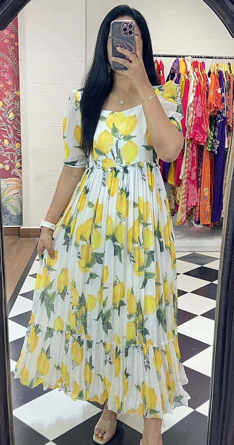 Lemon print maxi dress with short sleeves and ruffled hem detail.