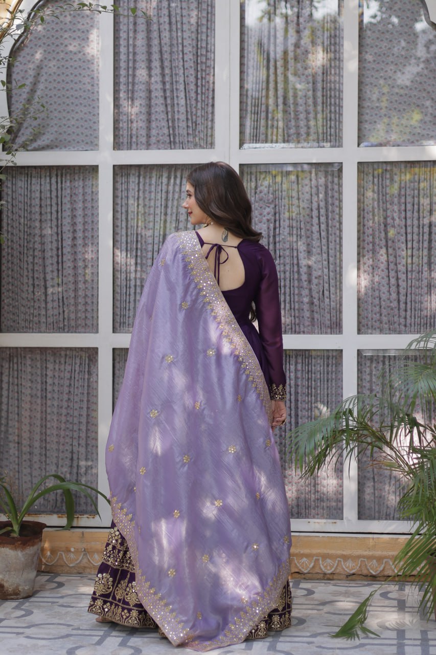 Rear view of purple gown and dupatta with gold sequin details.