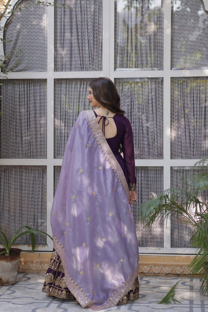 Rear view of purple gown and dupatta with gold sequin details.
